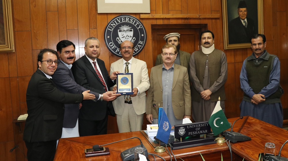 Vice Chancellor University of Peshawar Prof.Dr.Muhammad Asif khan is honouring Ranra University Kabul representatives for promoting initiatives for mutual academic exchange programs on 18th February, 2020.